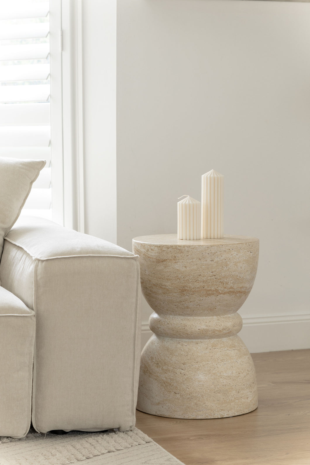 The hourglass side table - travertine - pre order arriving late May